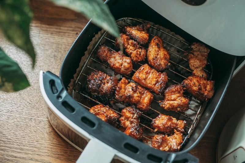 Food cooking inside a modern air fryer, the air fryer accessories category